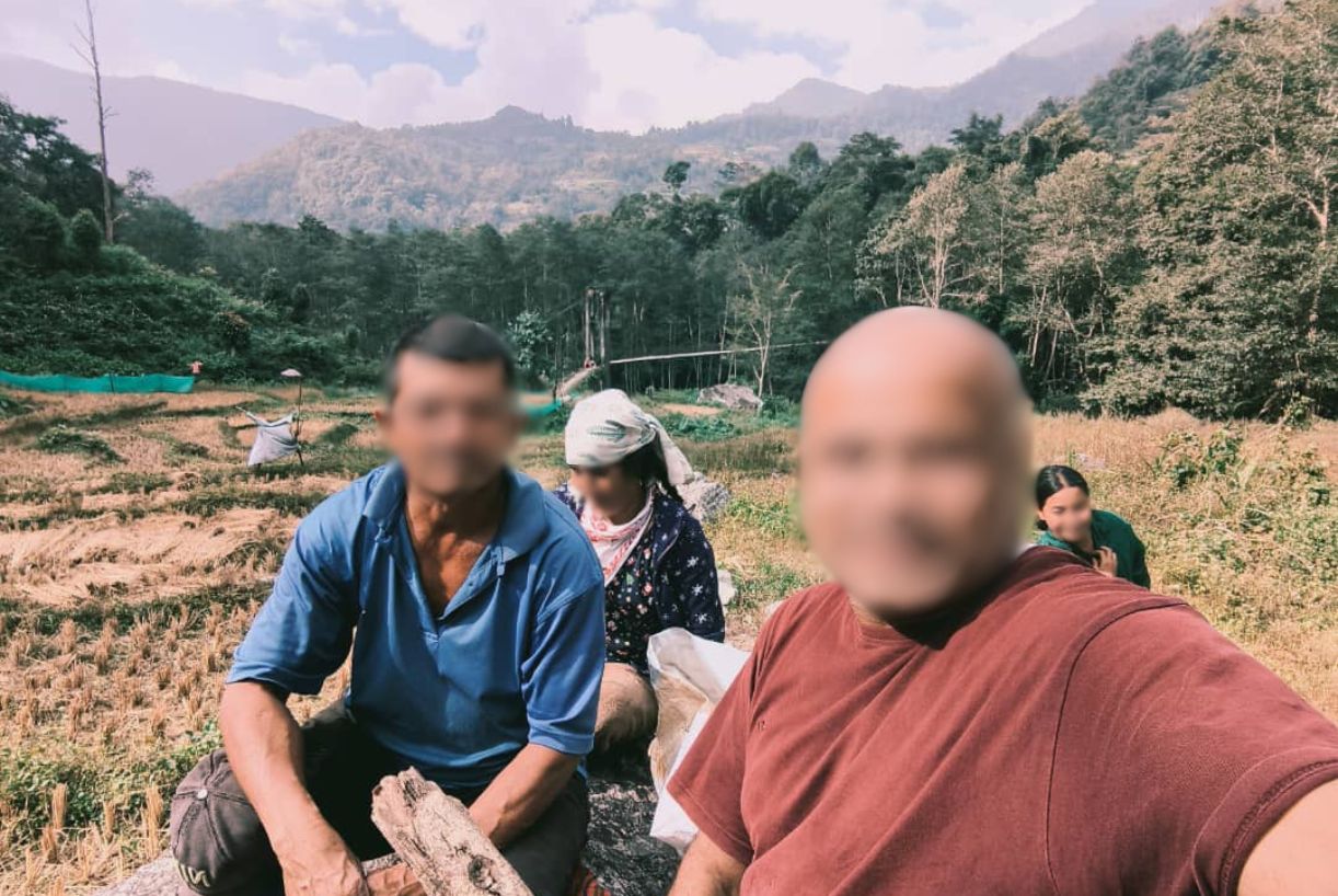 A group of people in a field in South Asia